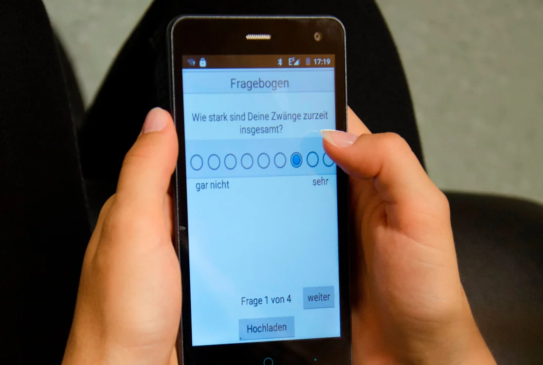 Person taps on smartphone