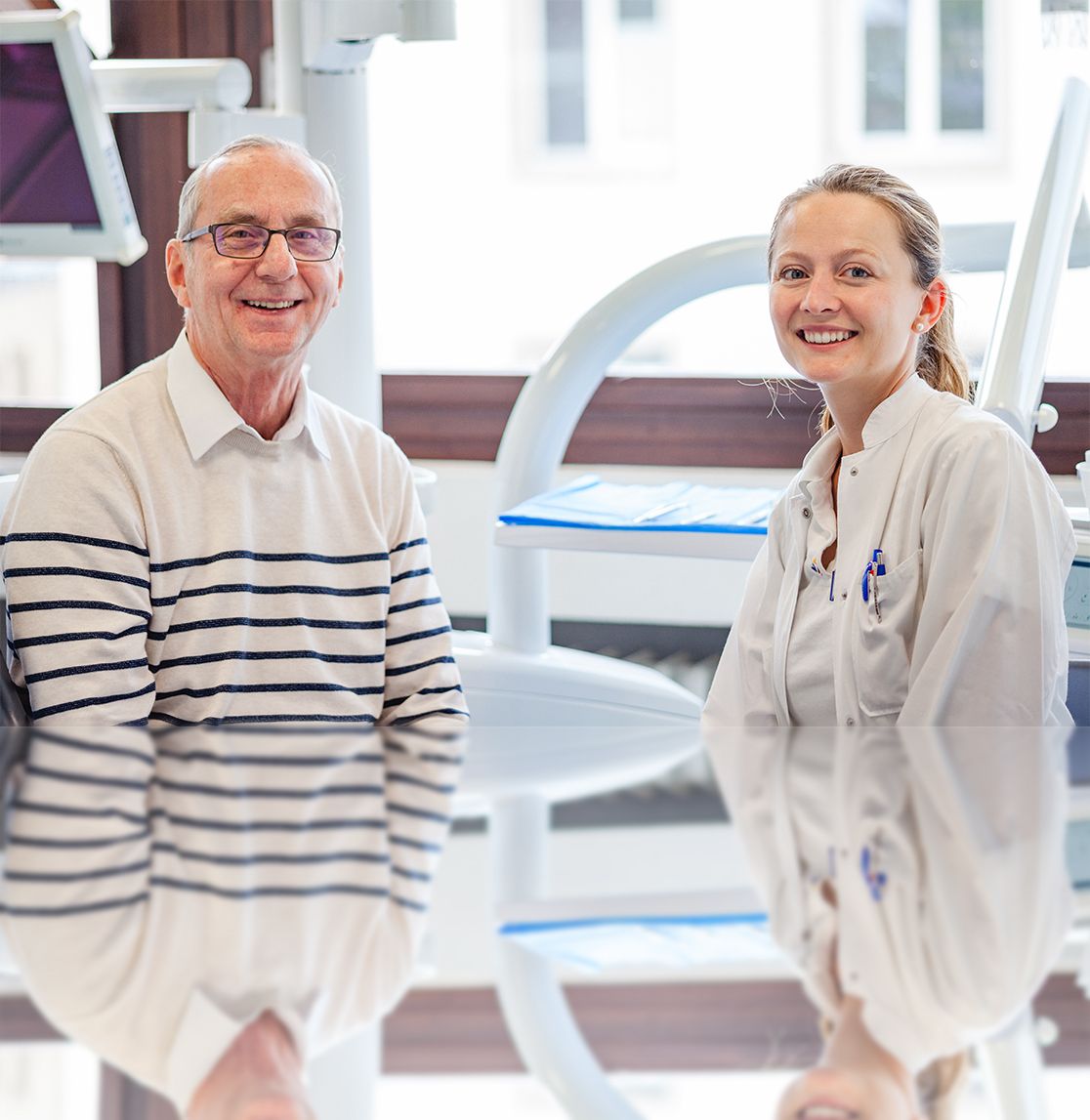 Mrs. Kramarczyck and Mr. Schiemann smile into the camera