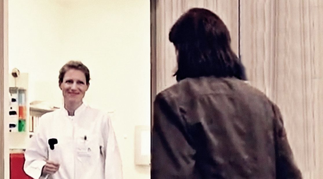 Doctor receives patient