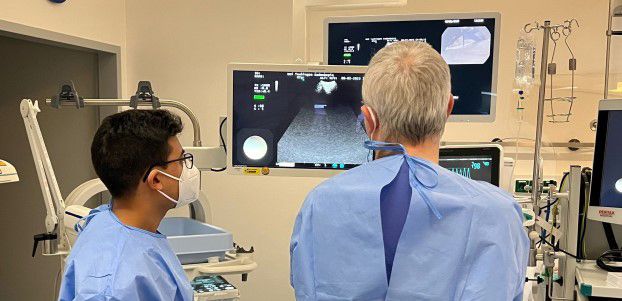 Two female doctors in front of medical equipment