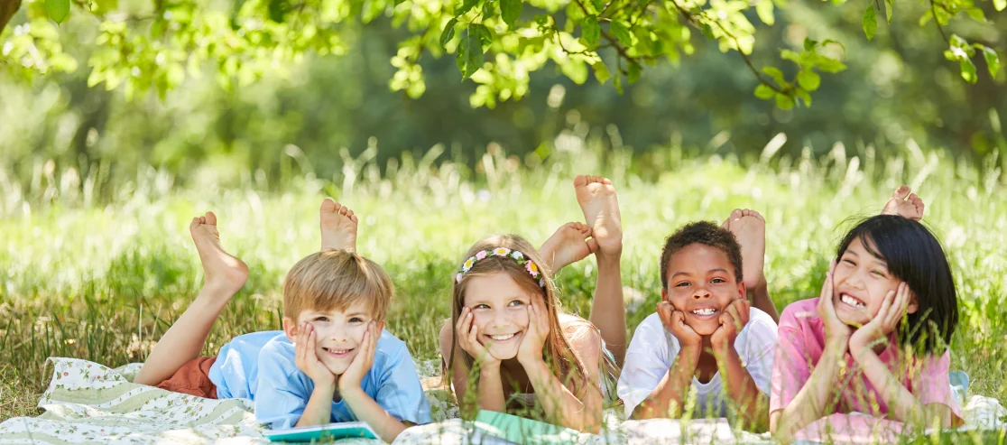 Children lie in the meadow