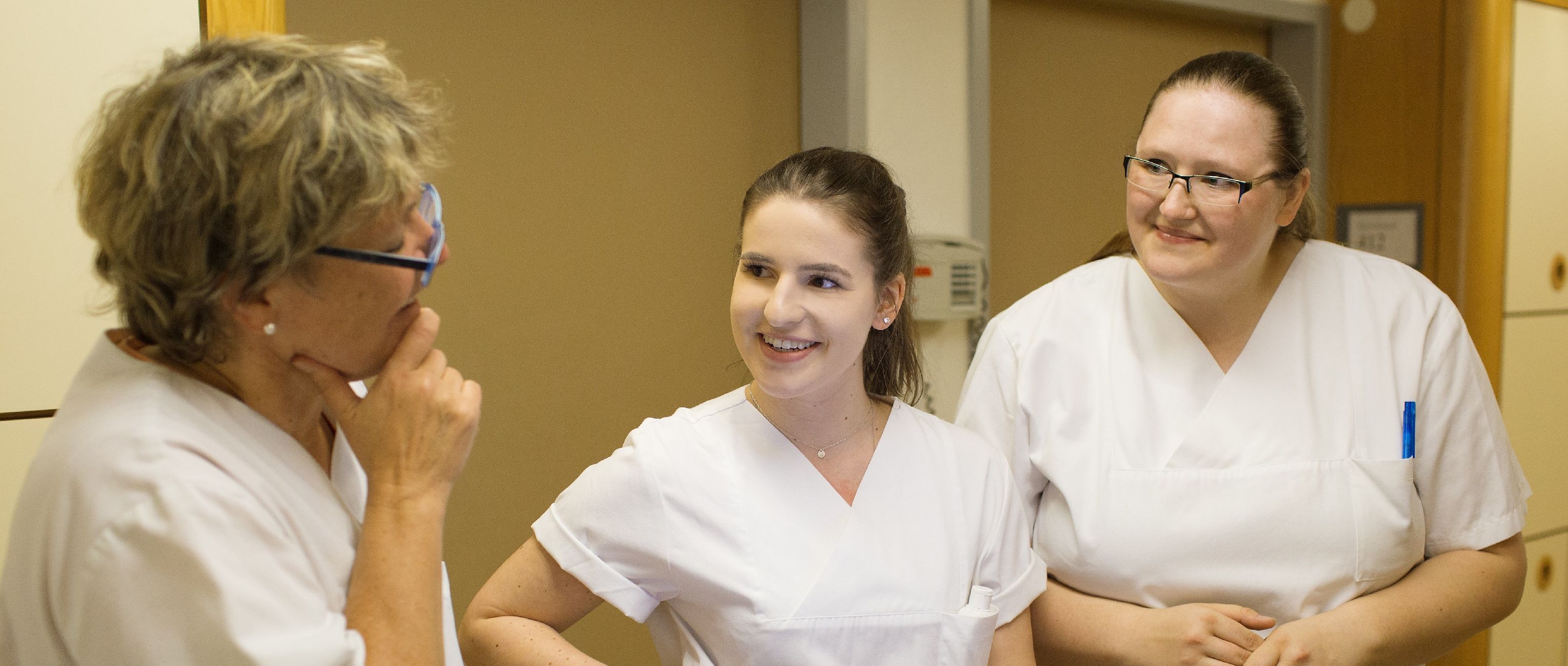 Nursing students talking to a trainer